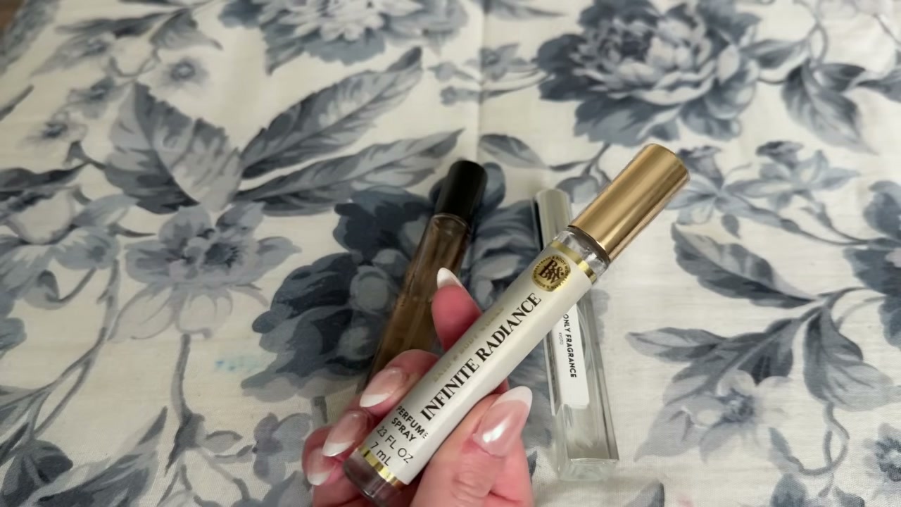 @laura.lavigne reviewing Bath & Body Works Infinite Radiance Travel Perfume at 20:37 in a YouTube Shorts video