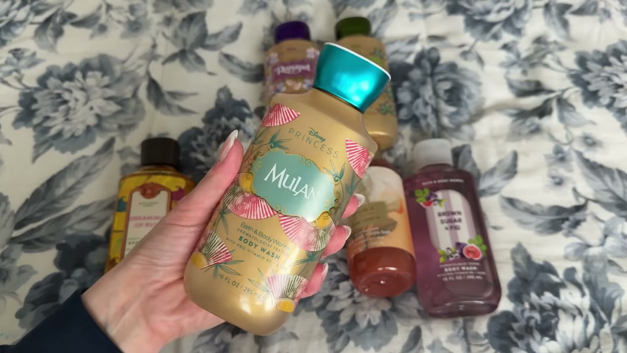 @laura.lavigne reviewing Bath & Body Works Mulan Magnolia Blossoms Body Wash at 04:15 in a YouTube Shorts video