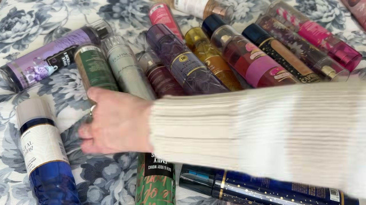 @laura.lavigne reviewing Bath & Body Works Sunrise Woods at 33:43 in a YouTube Shorts video