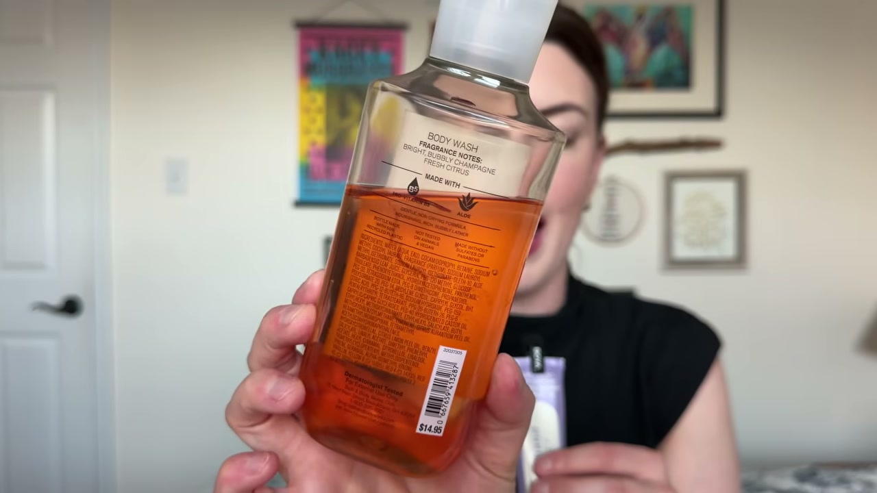 @laura.lavigne reviewing Bath & Body Works Sunshine Mimosa Body Wash at 01:00 in a YouTube Shorts video