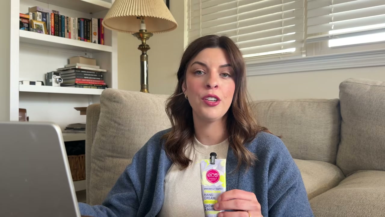@laura.lavigne reviewing eos Cashmere Lip Butter at 14:51 in a YouTube Shorts video