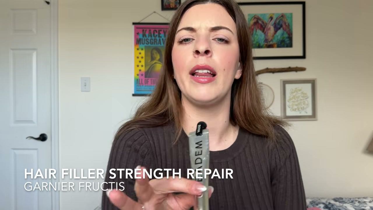 @laura.lavigne reviewing Garnier Fructis Hair Filler Strength Repair Shampoo at 04:09 in a YouTube Shorts video