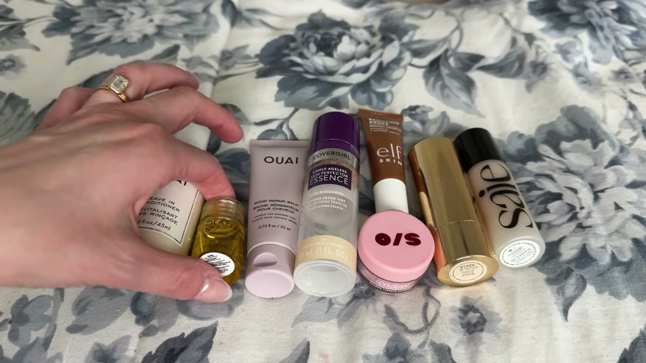 @laura.lavigne reviewing Olaplex Bonding Oil at 28:01 in a YouTube Shorts video