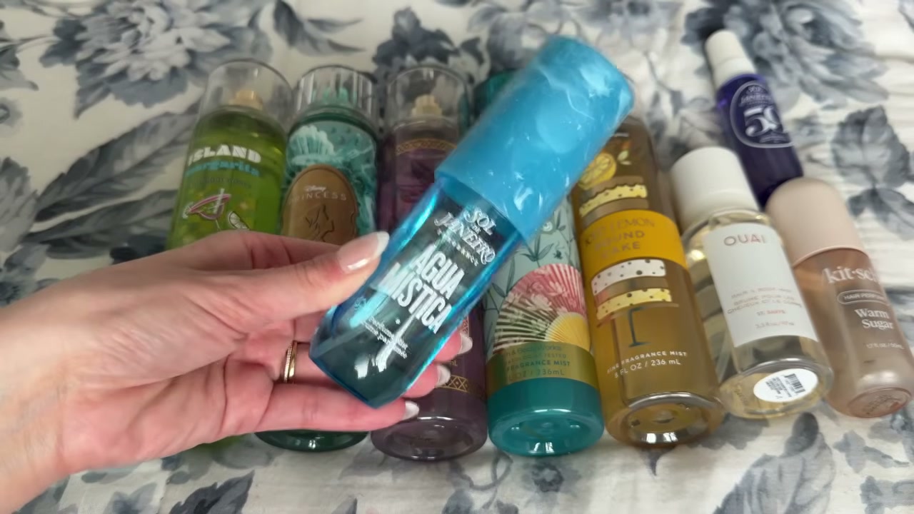 @laura.lavigne reviewing Sol de Janeiro Aqua Mista Body Mist at 14:50 in a YouTube Shorts video