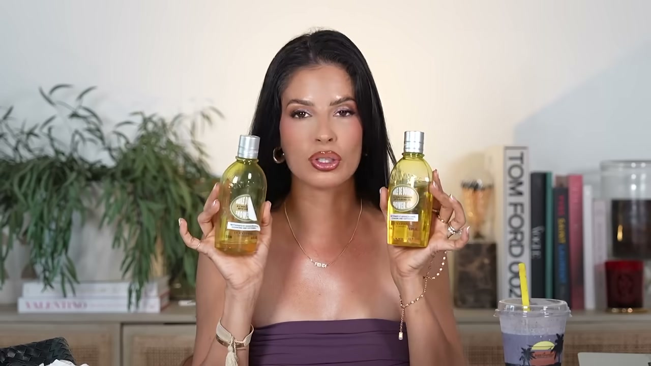 @laura88lee reviewing L'Occitane Shower Oil at 10:36 in a YouTube Shorts video