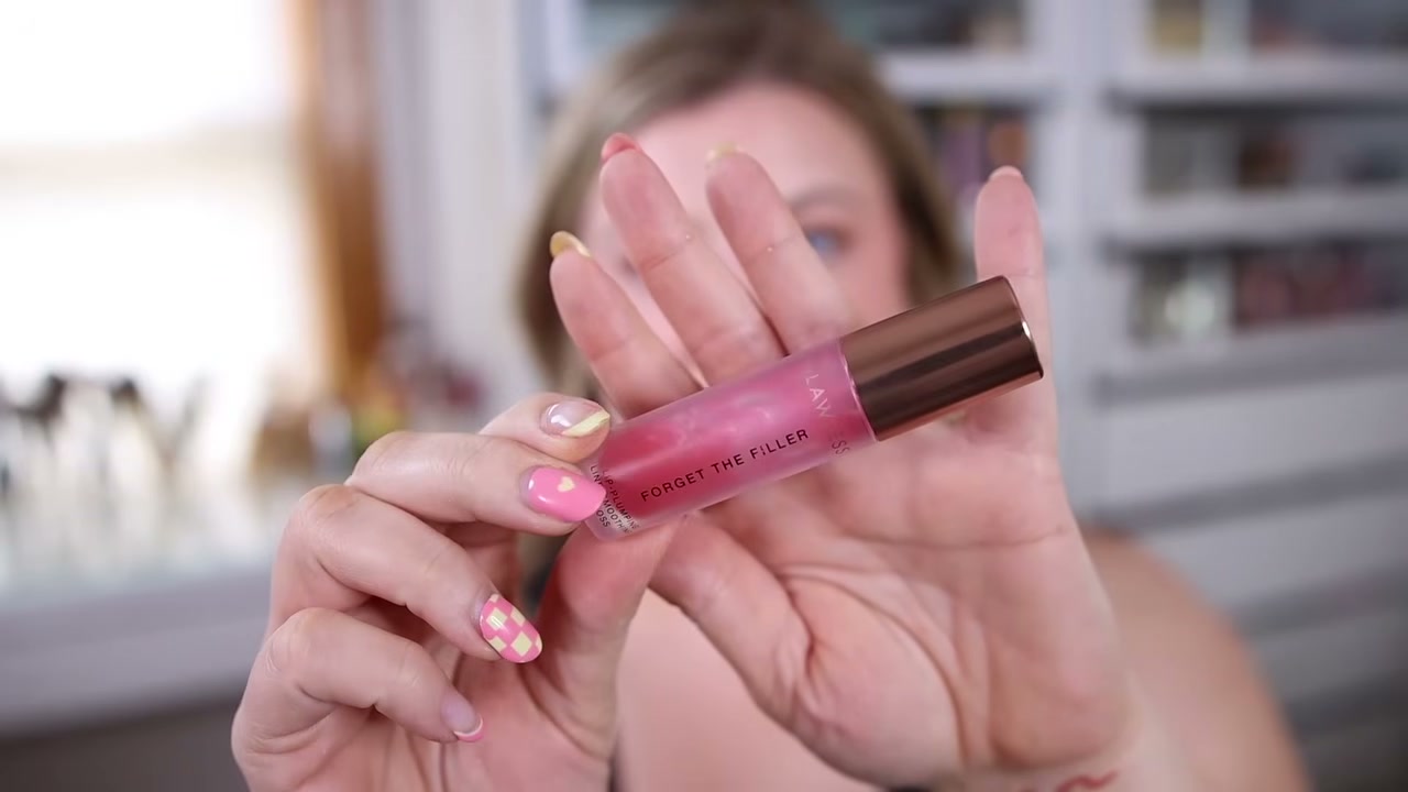 @leahjanae reviewing Lawless Forget the Filler Lip Plumper Line Smoothing Gloss at 15:38 in a YouTube Shorts video