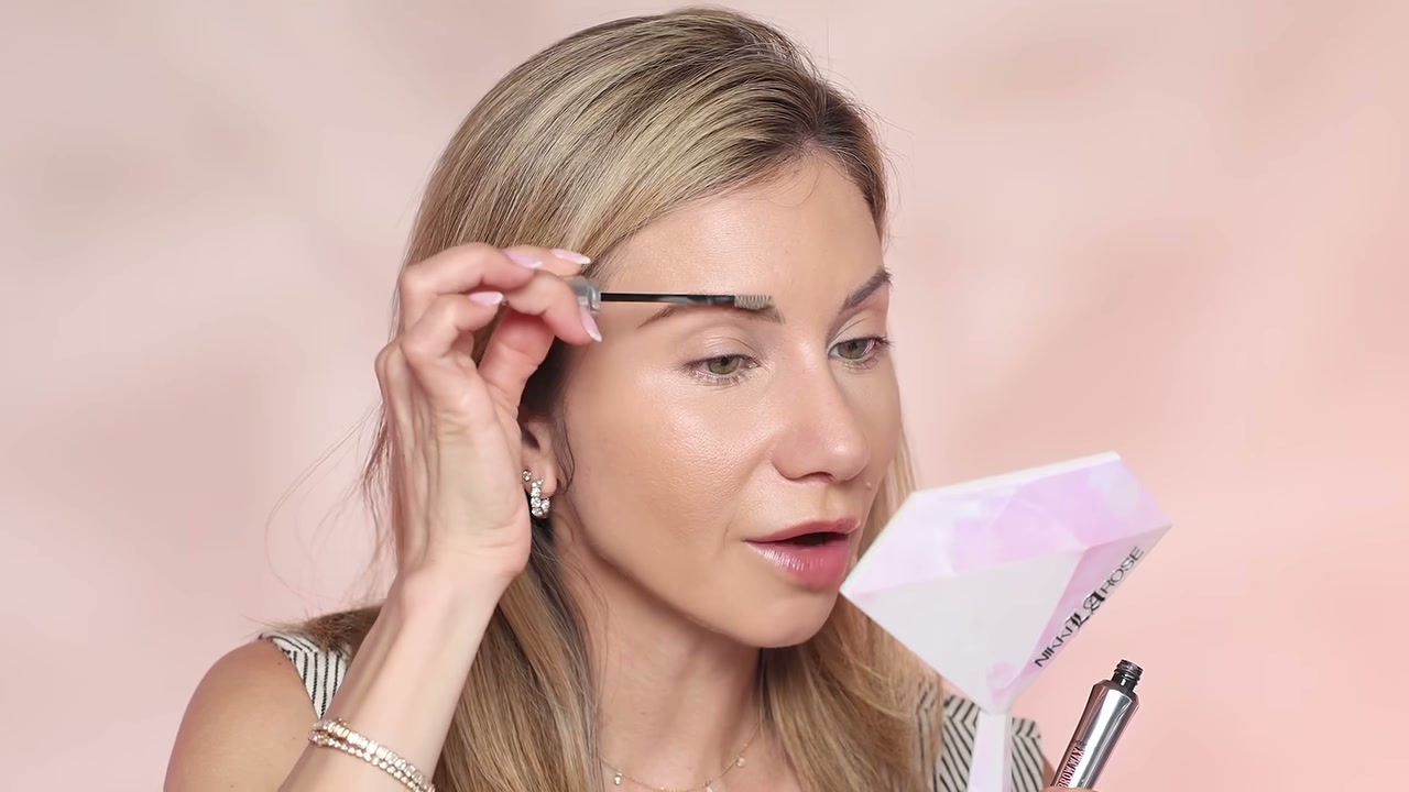 @lisajmakeup reviewing Benefit Cosmetics Brow Wax at 06:36 in a YouTube Shorts video