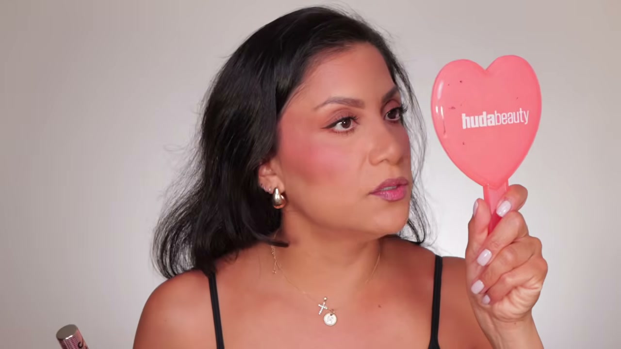 @magdalinejanet reviewing Maybelline Lifter Lip Oil at 21:57 in a YouTube Shorts video