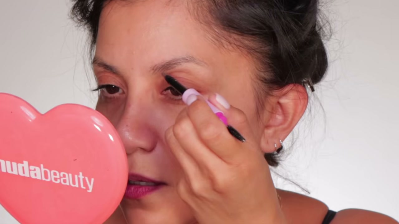 @magdalinejanet reviewing NYX Fluff & Snatch Brow Powder Pen at 02:10 in a YouTube Shorts video