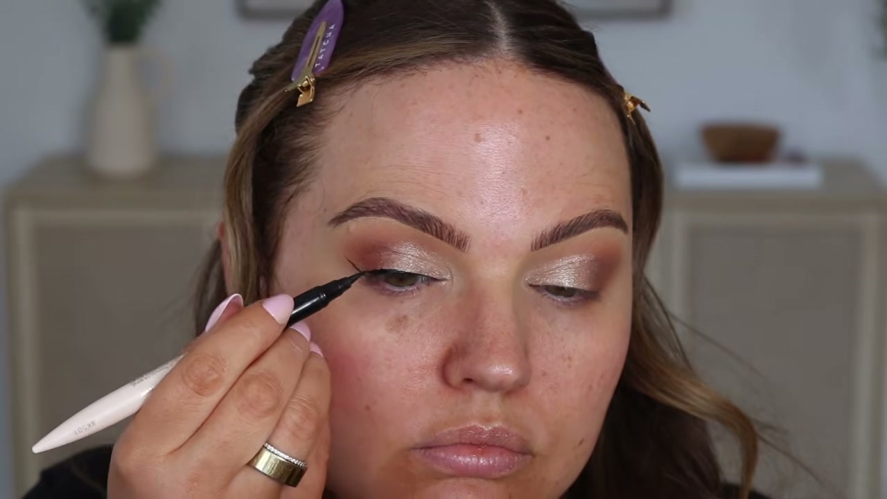 @makeupbycheryl reviewing Rare Beauty Perfect Strokes Matte Liquid Liner at 04:00 in a YouTube Shorts video
