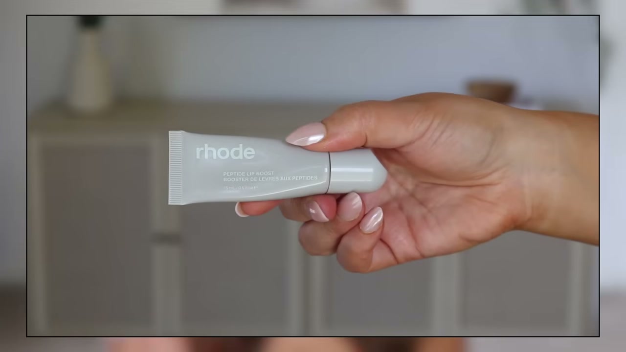 @makeupbycheryl reviewing Rhode Sugar Mint Lip Treatment at 33:57 in a YouTube Shorts video