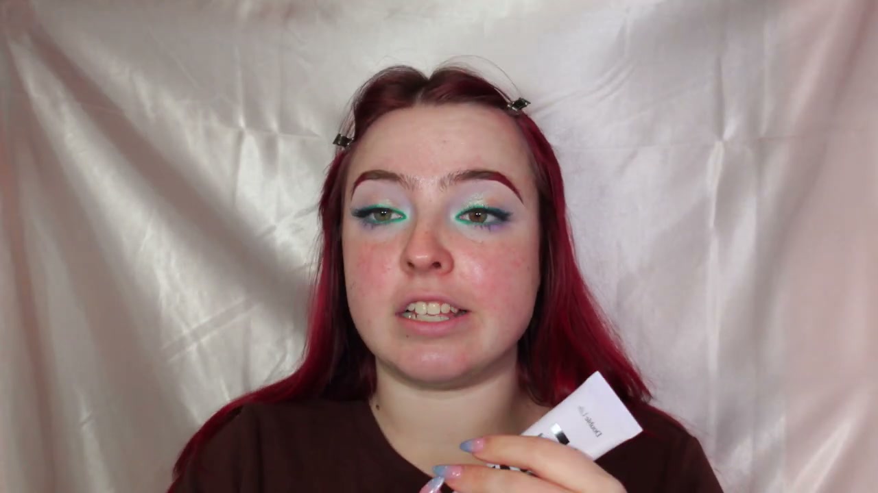 @makeupbymia_c reviewing Kulfi Double Life Serum Primer at 24:08 in a YouTube Shorts video