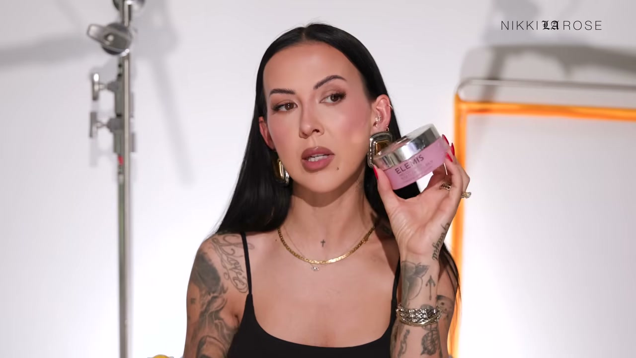 @makeupbynikkilarose reviewing ELEMIS Pro-Collagen Cleansing Balm at 10:07 in a YouTube Shorts video