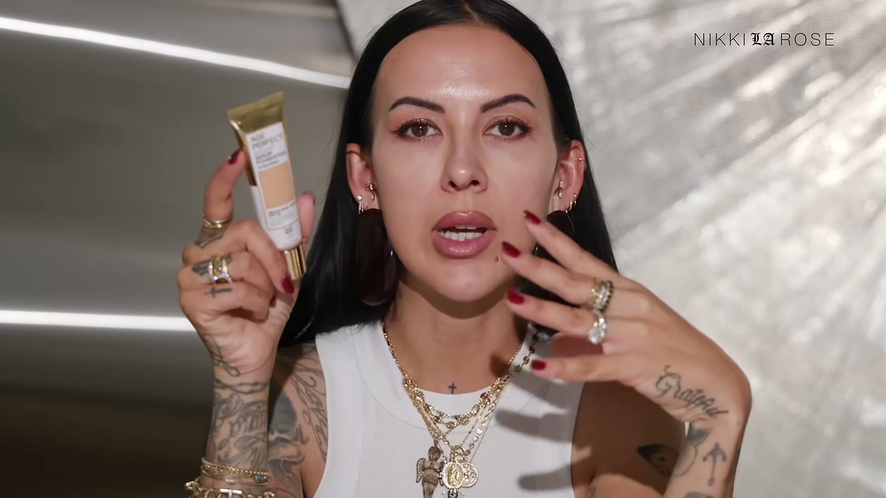 @makeupbynikkilarose reviewing L'Oreal Paris Age Perfect Serum Foundation at 11:52 in a YouTube Shorts video