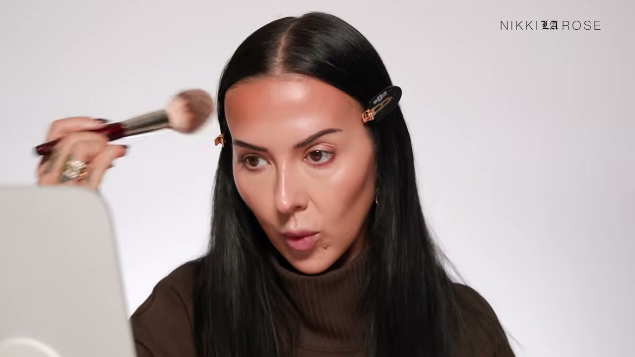 @makeupbynikkilarose reviewing Milani Baked Bronzer at 19:17 in a YouTube Shorts video