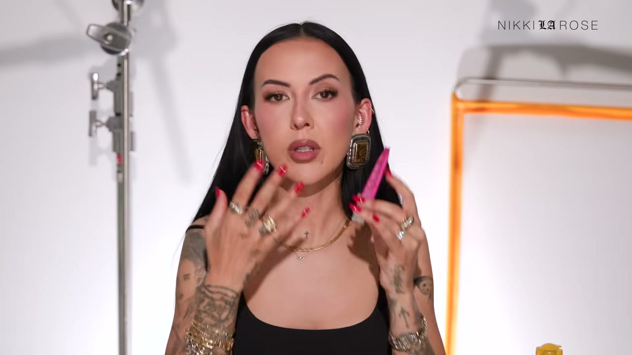 @makeupbynikkilarose reviewing Paula's Choice Pro-Collagen Peptide Lip Balm at 12:38 in a YouTube Shorts video