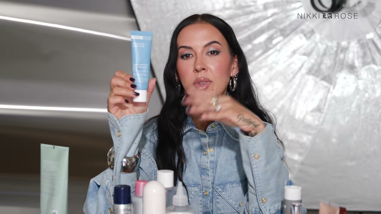 @makeupbynikkilarose reviewing Paula's Choice Youth Extending Daily Hydrating Fluid Broadspectrum SPF 50 Sunscreen at 16:24 in a YouTube Shorts video