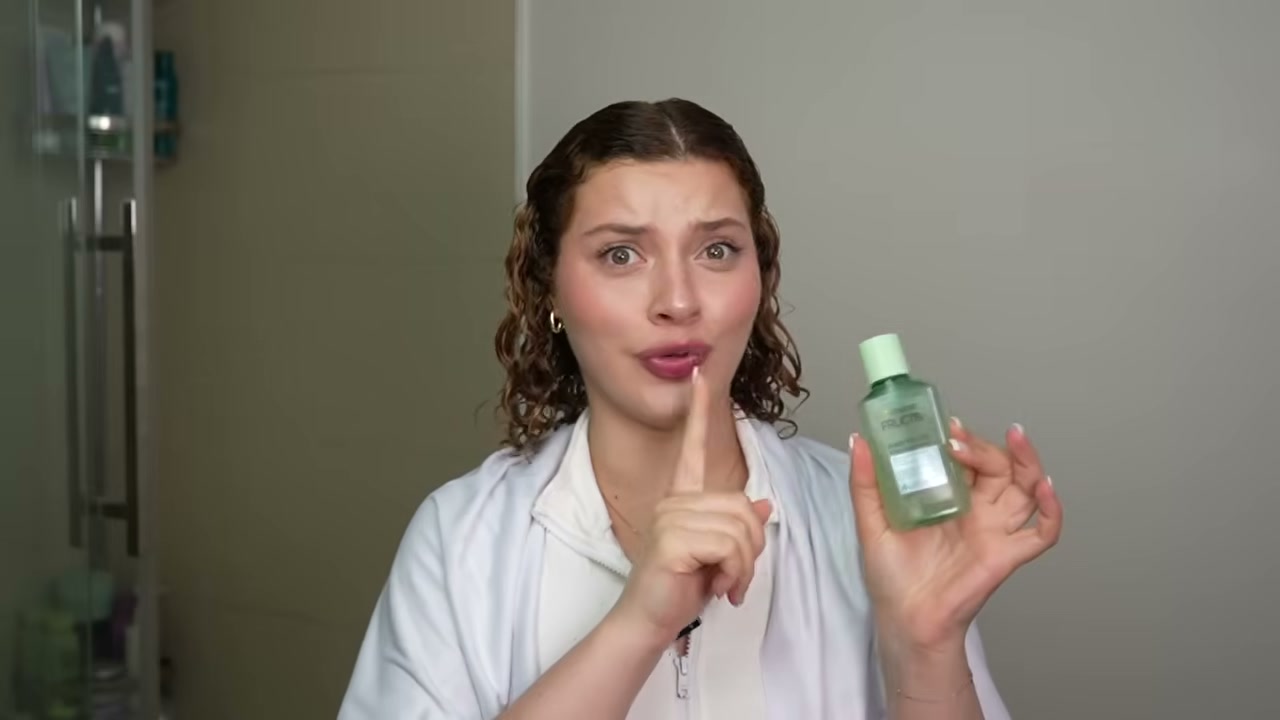 @manesbymell reviewing Garnier Fructis Hair Filler + Vitamin C Strength Repair Sulfate-Free Serum at 07:33 in a YouTube Shorts video