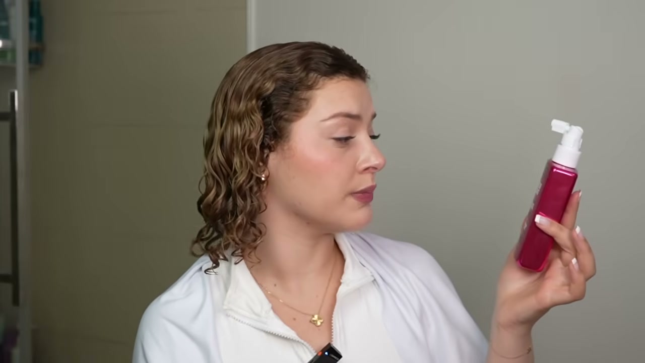 @manesbymell reviewing Marc Anthony Anti-Frizz Shield Ultimate Blowout Spray at 09:20 in a YouTube Shorts video