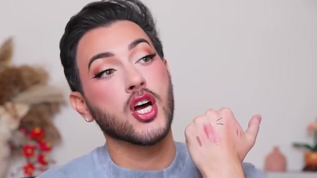 @mannymua733 reviewing Hard Candy Soft Glossy Plump with Plumping Peptides Lip Melts at 17:11 in a YouTube Shorts video