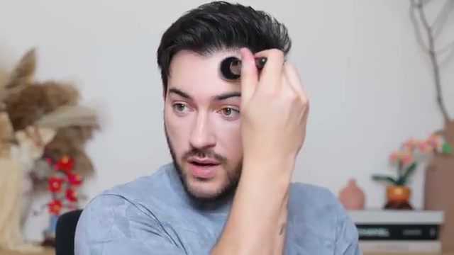 @mannymua733 reviewing Nude by Nature Perfect Skin Filter Foundation at 04:03 in a YouTube Shorts video