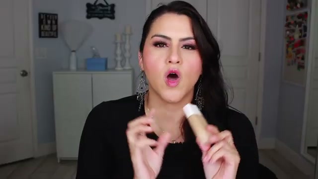 @melirodriguez reviewing Fenty Beauty Ease Drops at 03:14 in a YouTube Shorts video