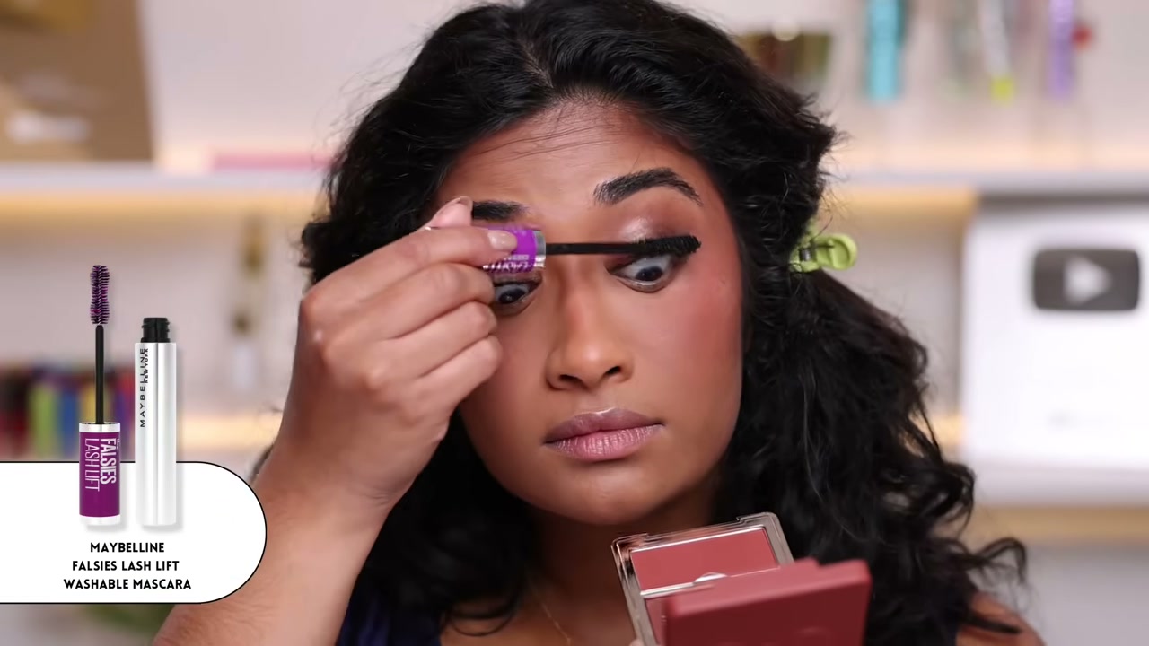 @monica.raviii reviewing Maybelline Falsies Lash Lift Volumizing and Lengthening Mascara at 16:03 in a YouTube Shorts video