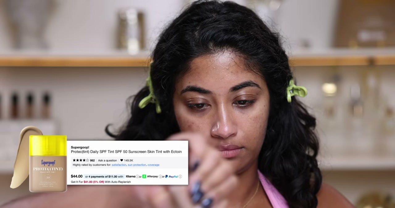 @monica.raviii reviewing Supergoop! Protec(tint) Daily SPF Tint SPF 50 Sunscreen Skin Tint with Ectoin at 15:41 in a YouTube Shorts video
