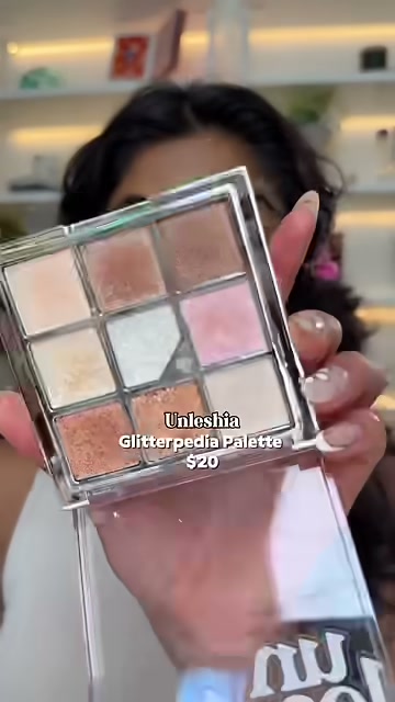 @monica.raviii reviewing Unleashia Glitteredia Palette at 00:56 in a YouTube Shorts video