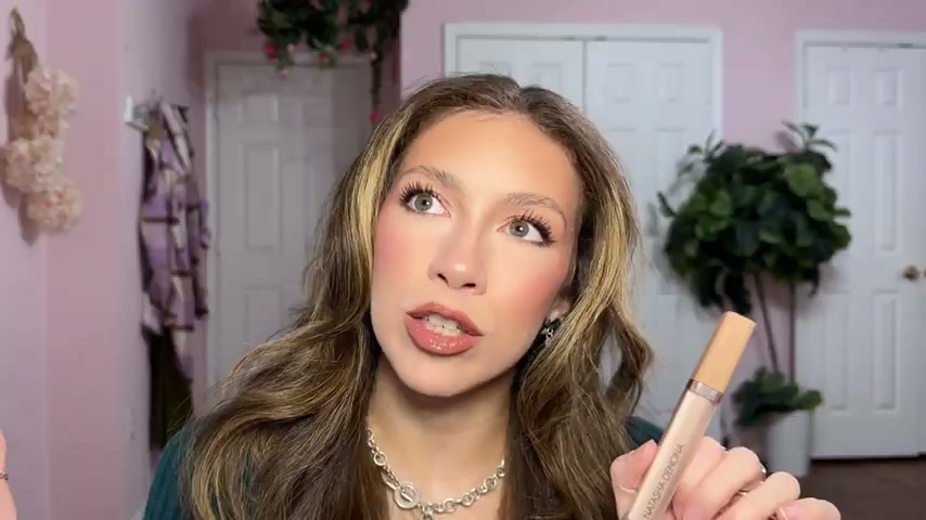 @moorebeautifully reviewing Natasha Denona Hyglam Concealer at 10:17 in a YouTube Shorts video