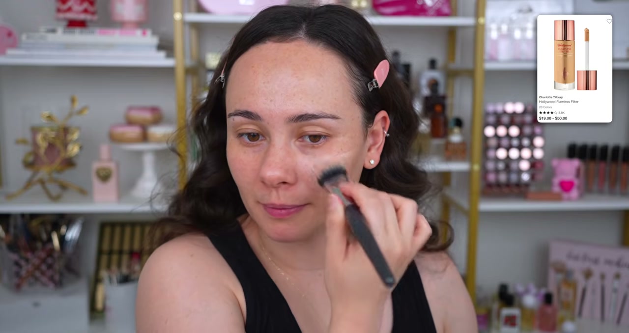 @morganturnermakeup reviewing Charlotte Tilbury Hollywood Flawless Filter at 04:34 in a YouTube Shorts video