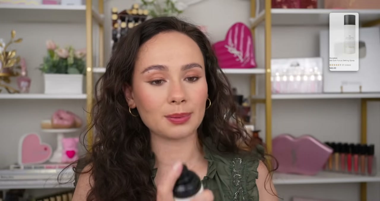 @morganturnermakeup reviewing Hourglass Veil Soft Focus Setting Spray at 06:49 in a YouTube Shorts video