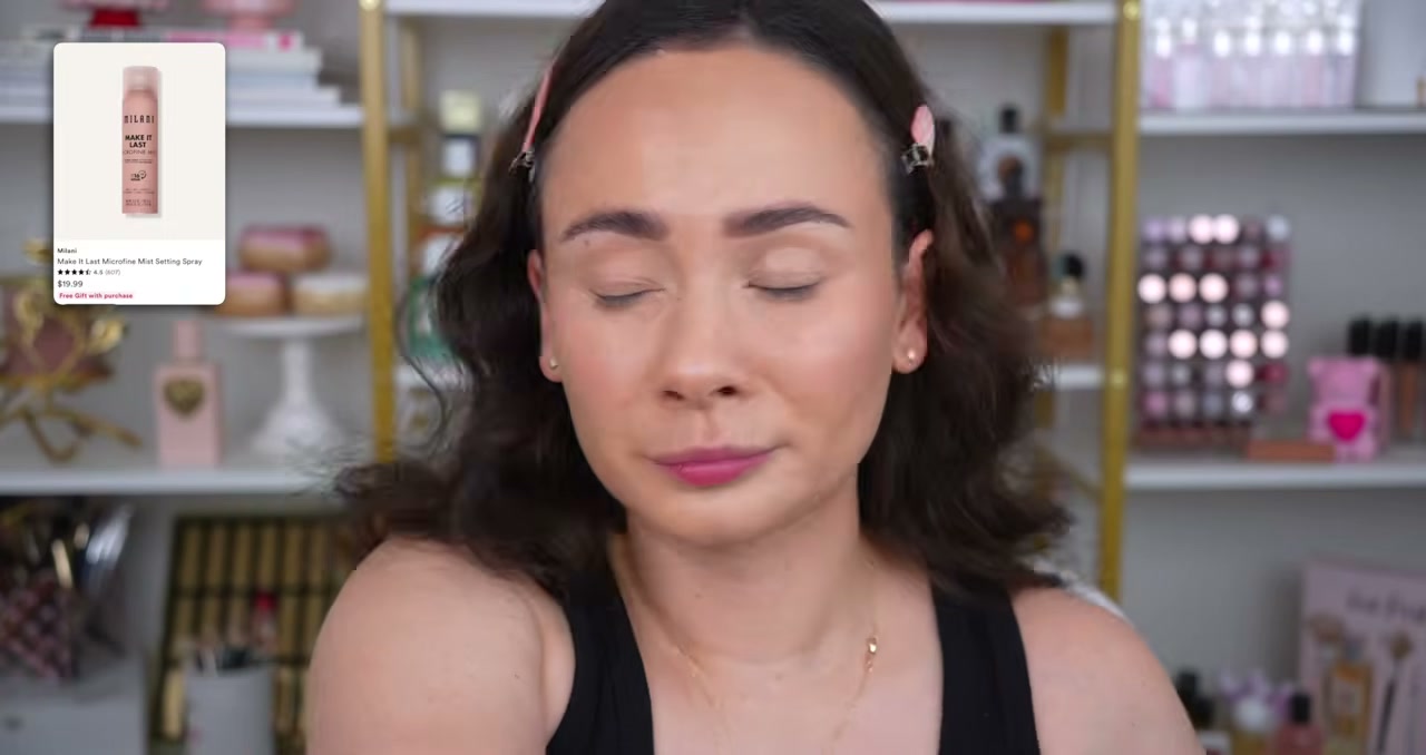 @morganturnermakeup reviewing Milani Make It Last Microfine Mist at 18:06 in a YouTube Shorts video