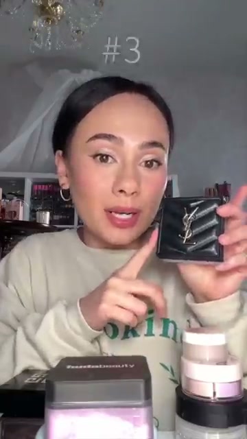 @morganturnermakeup reviewing Yves Saint Laurent All Hours Hyper Blur Loose Setting Powder at 01:56 in a YouTube Shorts video