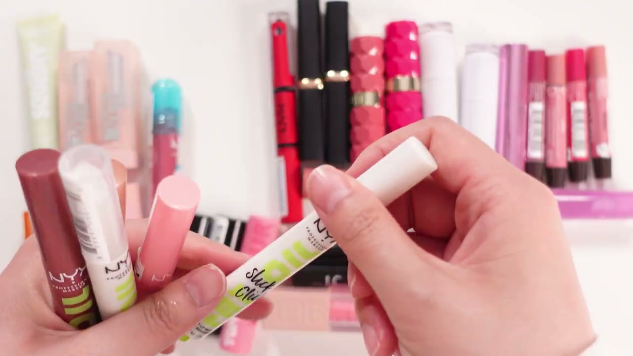 @ms.angiekim reviewing NYX Fat Oil Slick Click Shiny Lip Balm at 12:01 in a YouTube Shorts video