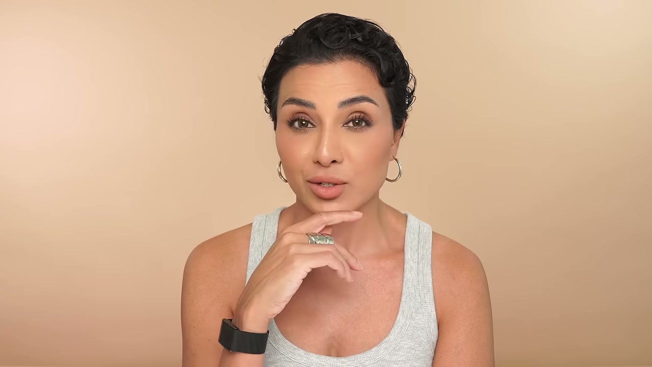 @ninaubhibeautyandfashion reviewing COSRX Six Peptide Booster Serum at 09:17 in a YouTube Shorts video