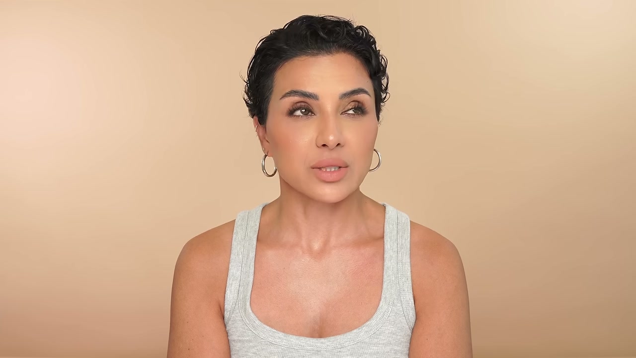 @ninaubhibeautyandfashion reviewing Qure Micro-Infusion Facial System at 10:44 in a YouTube Shorts video
