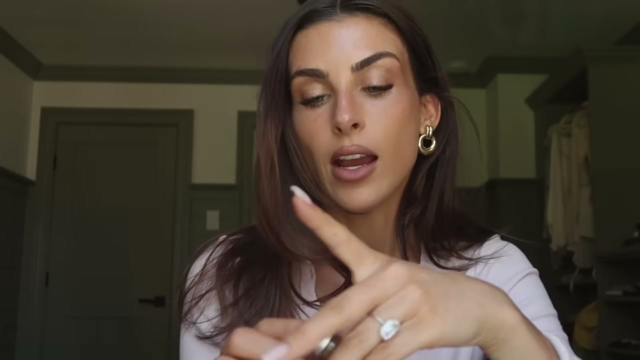 @paigelorenze reviewing Isle of Paradise Color Correcting Serum at 04:29 in a YouTube Shorts video