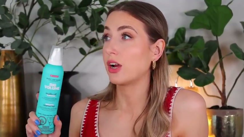 @rachhloves reviewing Marc Anthony Big Volume Weightless Lift Mousse at 15:31 in a YouTube Shorts video