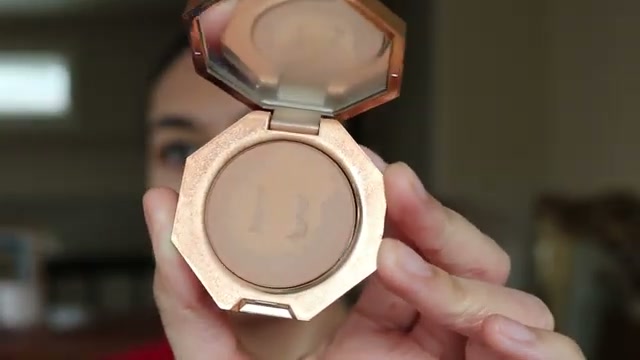 @rainiercramer reviewing Fenty Beauty Sun Stalk'r Instant Warmth Bronzer at 01:48 in a YouTube Shorts video
