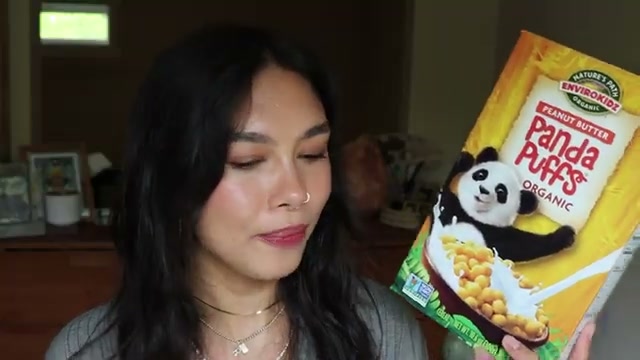 @rainiercramer reviewing IHERB Envirokidz Organic Panda Puffs Cereal at 18:21 in a YouTube Shorts video