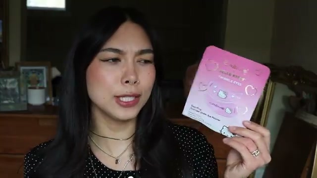 @rainiercramer reviewing THE Crème SHOP Hello Kitty Apple of My Eye Brightening Hydrogel Under Eye Patches at 03:54 in a YouTube Shorts video