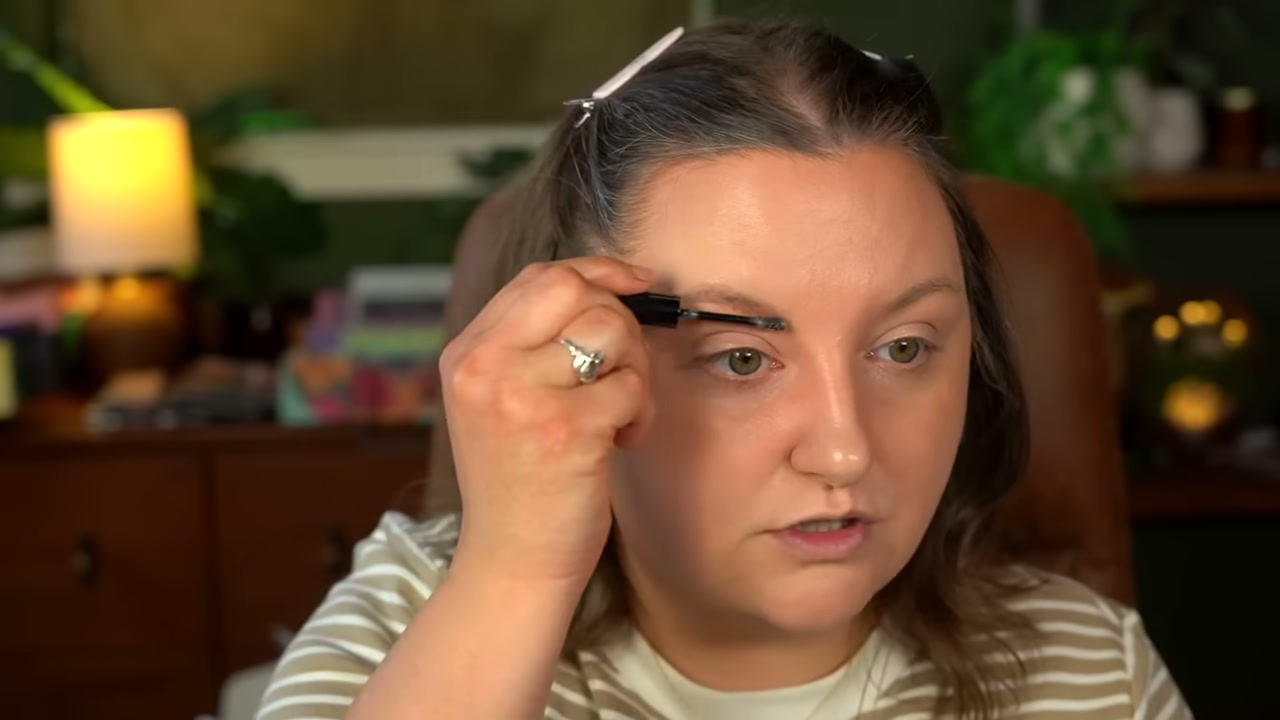 @rawbeautykristi reviewing NYX Brow Glue at 09:39 in a YouTube Shorts video