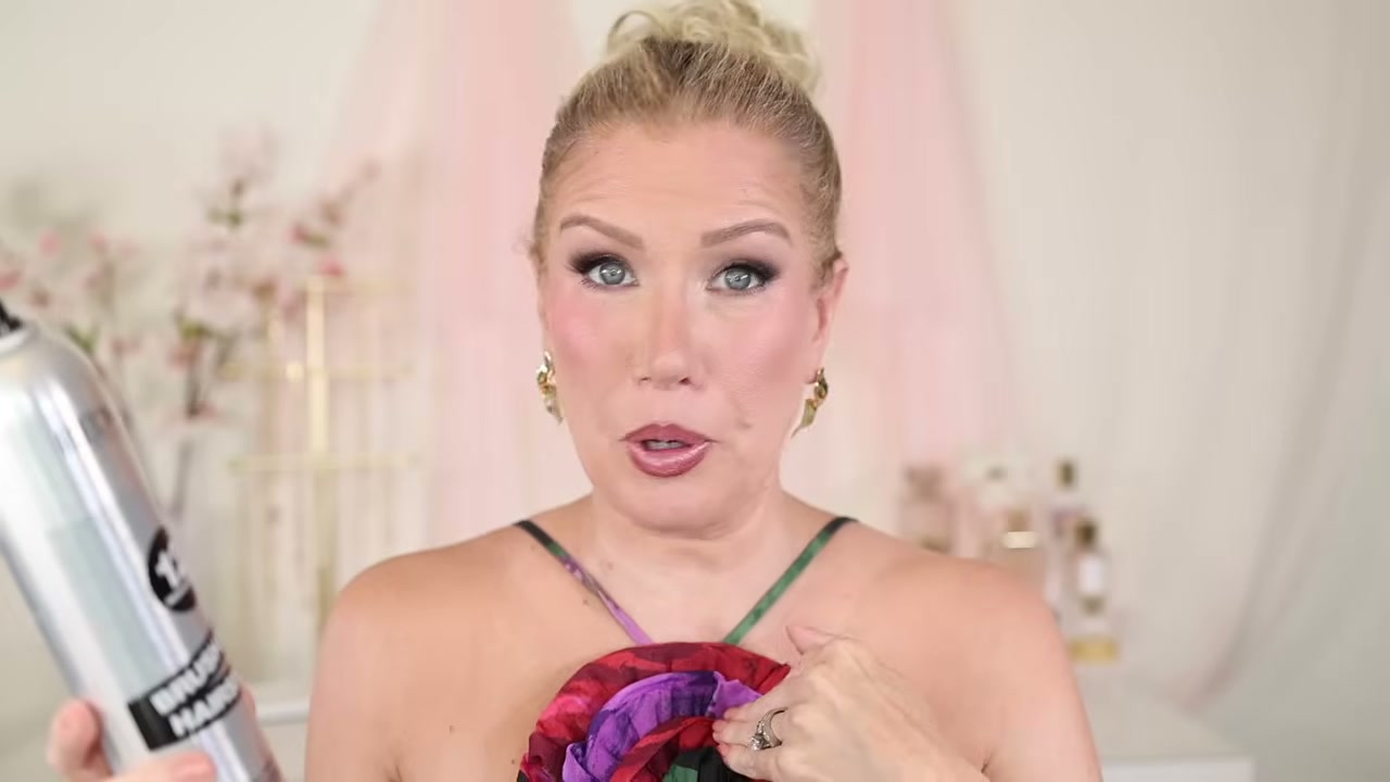 @risadoesmakeup reviewing Redken 12 Brushable Hairspray at 12:48 in a YouTube Shorts video