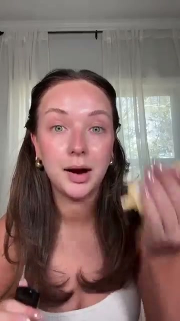 @shelbyannbell reviewing Hard Candy Glow On Lock Primer at 00:54 in a YouTube Shorts video