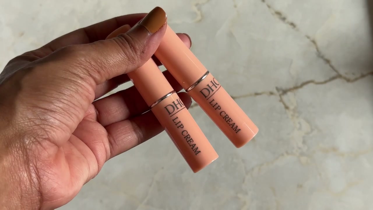 @shelleynayak reviewing DHC Lip Cream at 18:10 in a YouTube Shorts video