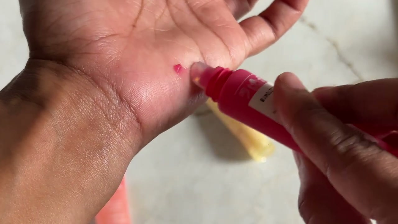 @shelleynayak reviewing Laneige Lip Glowy Balm at 02:32 in a YouTube Shorts video