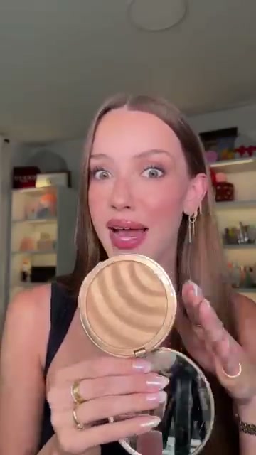 @skylerreneee reviewing Kapari Sunvil Illuminating Sunscreen at 02:15 in a YouTube Shorts video