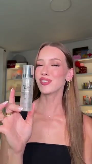 @skylerreneee reviewing Milani Make It Last Setting Spray at 00:26 in a YouTube Shorts video