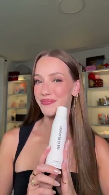 @skylerreneee reviewing Morphe Life Proof Setting Spray at 00:34 in a YouTube Shorts video